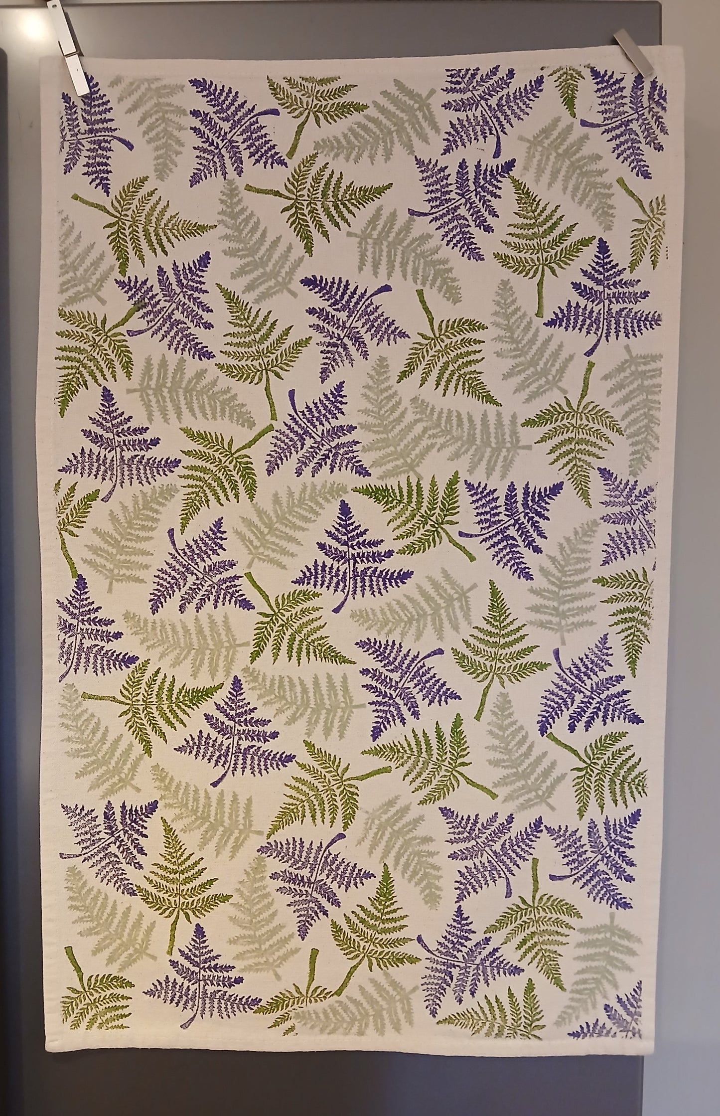 Ferns in two greens & purple on cotton teatowel