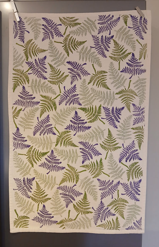 Ferns in two greens & purple on cotton teatowel