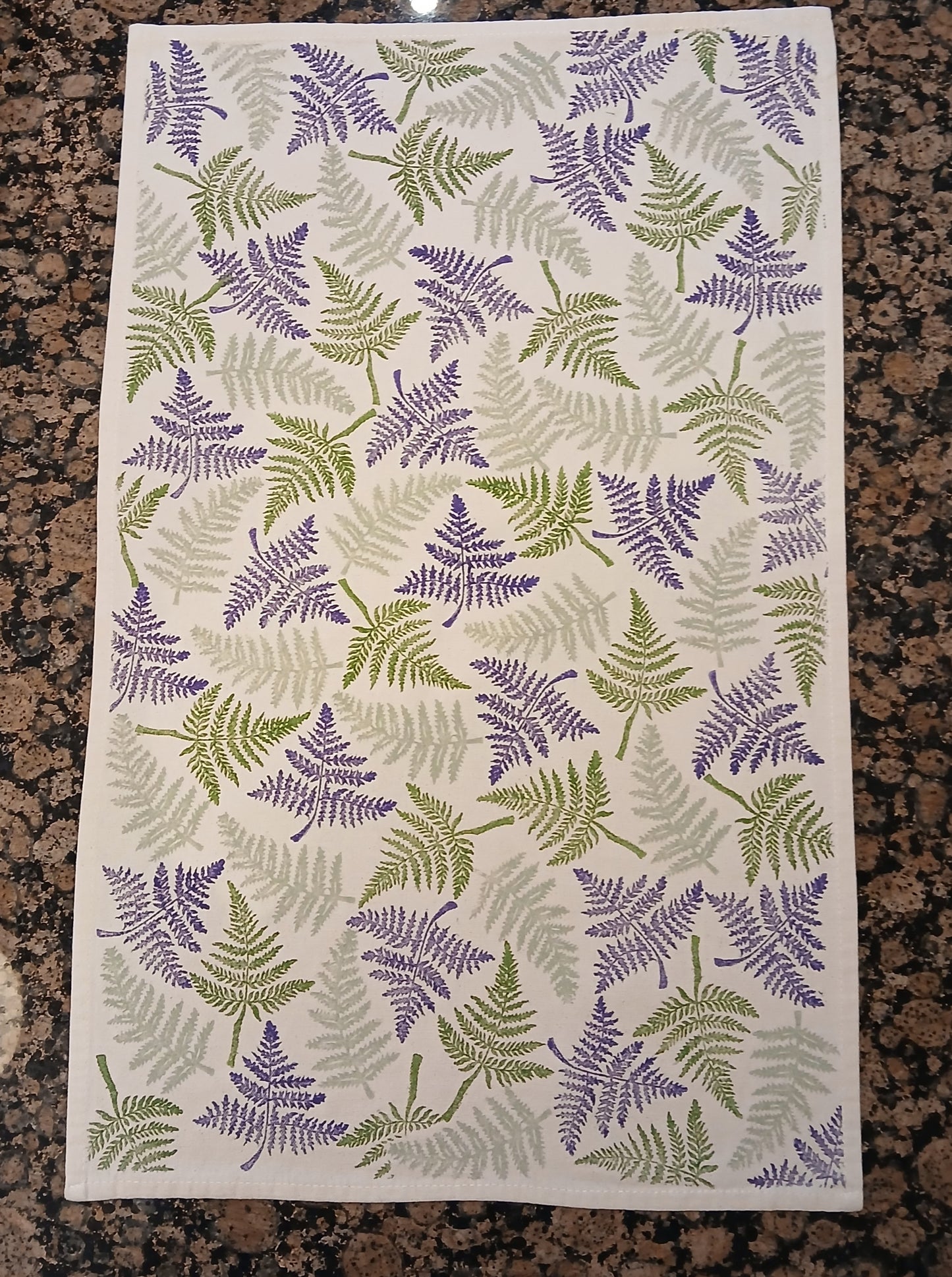 Ferns in two greens & purple on cotton teatowel