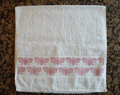 Bees in rose pink on cotton hand towel