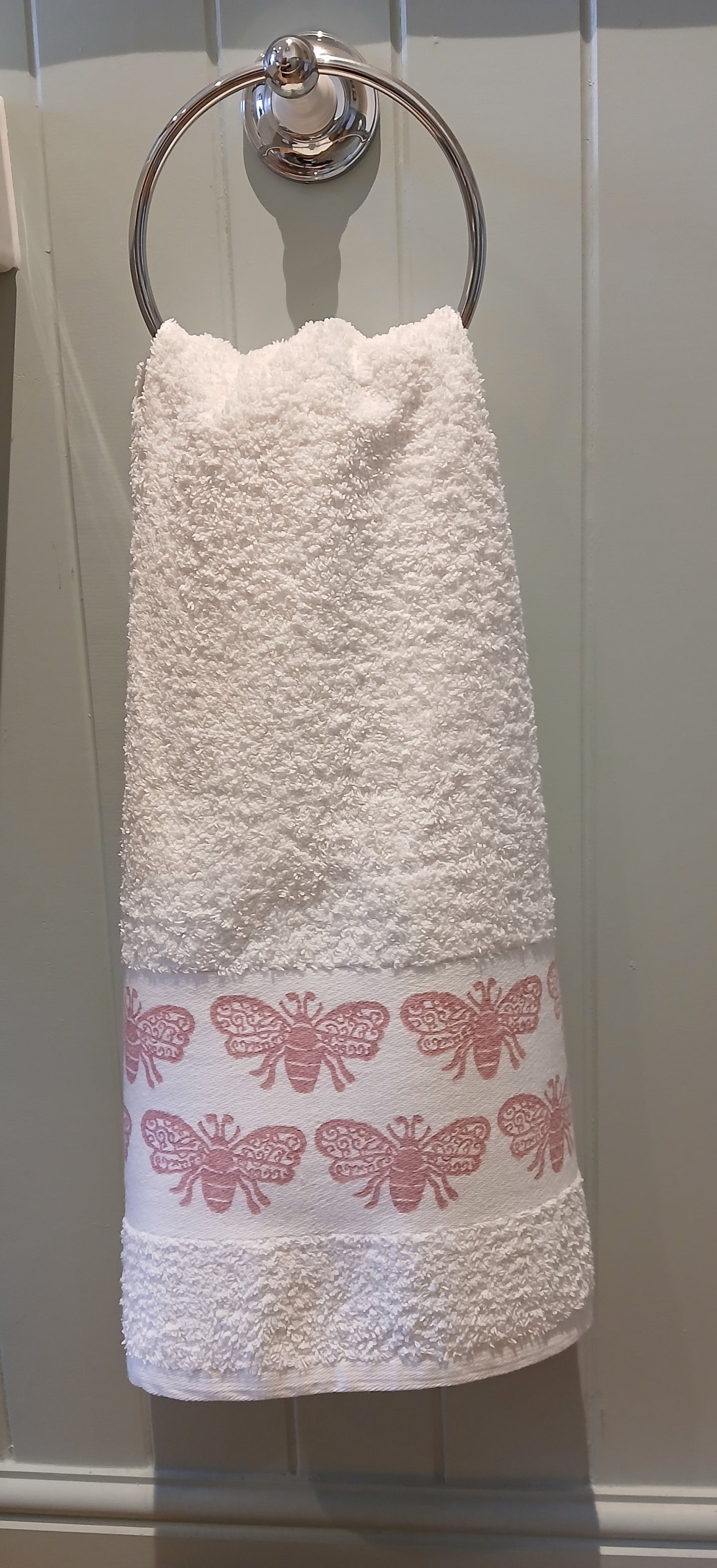Bees in rose pink on cotton hand towel