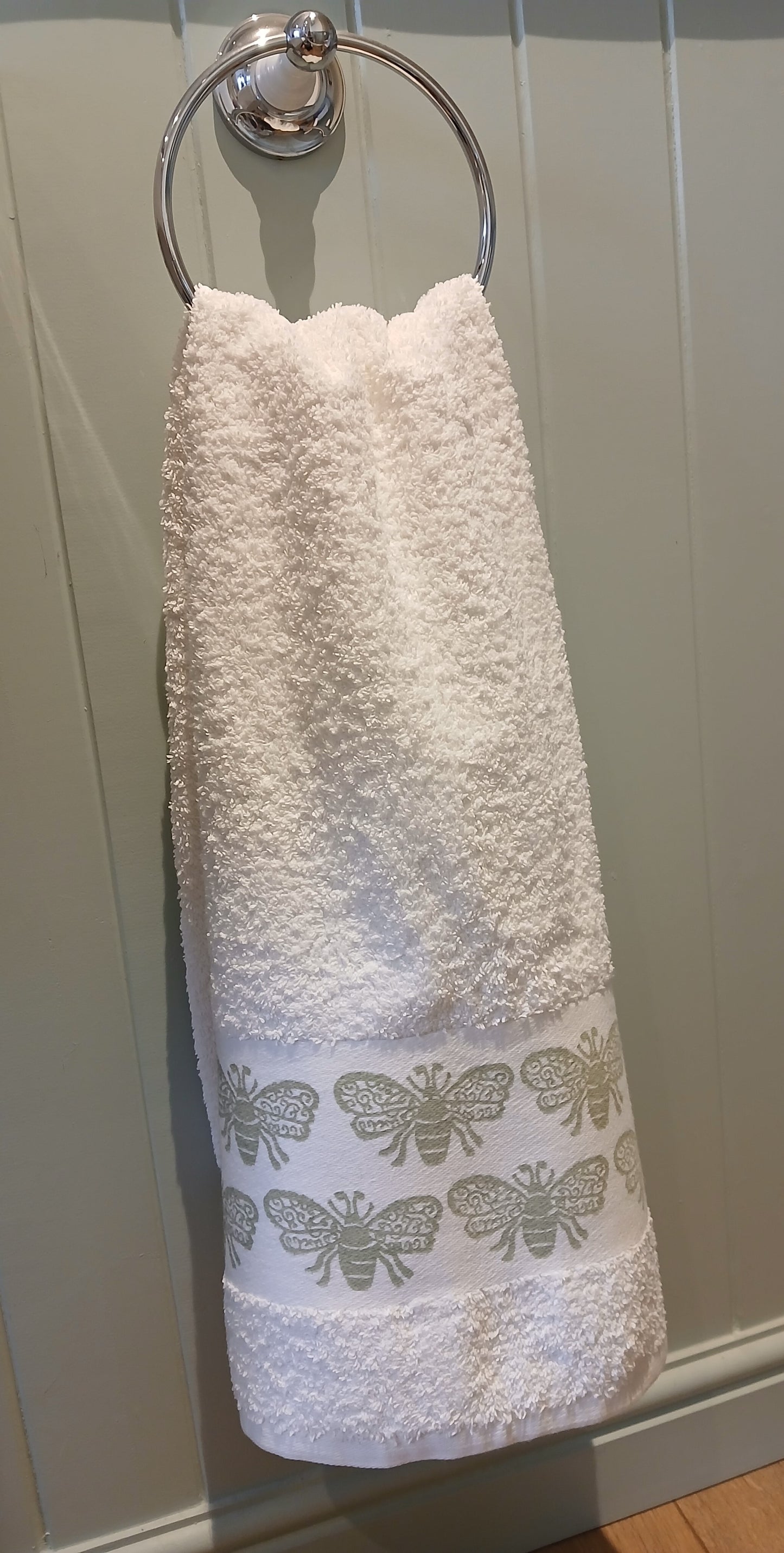 Bees in pale green on cotton hand towel