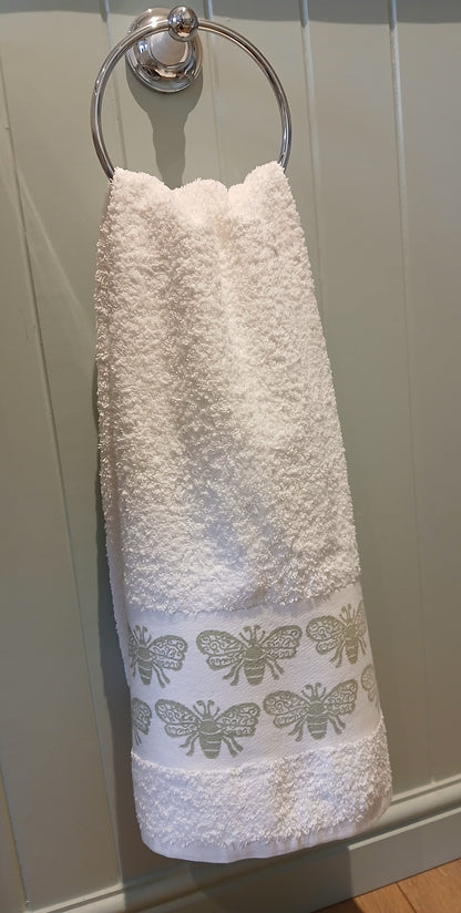 Bees in pale green on cotton hand towel