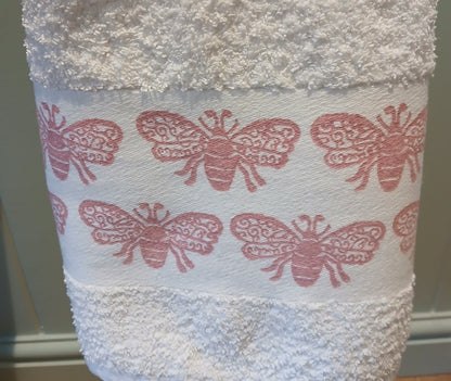 Bees in rose pink on cotton hand towel