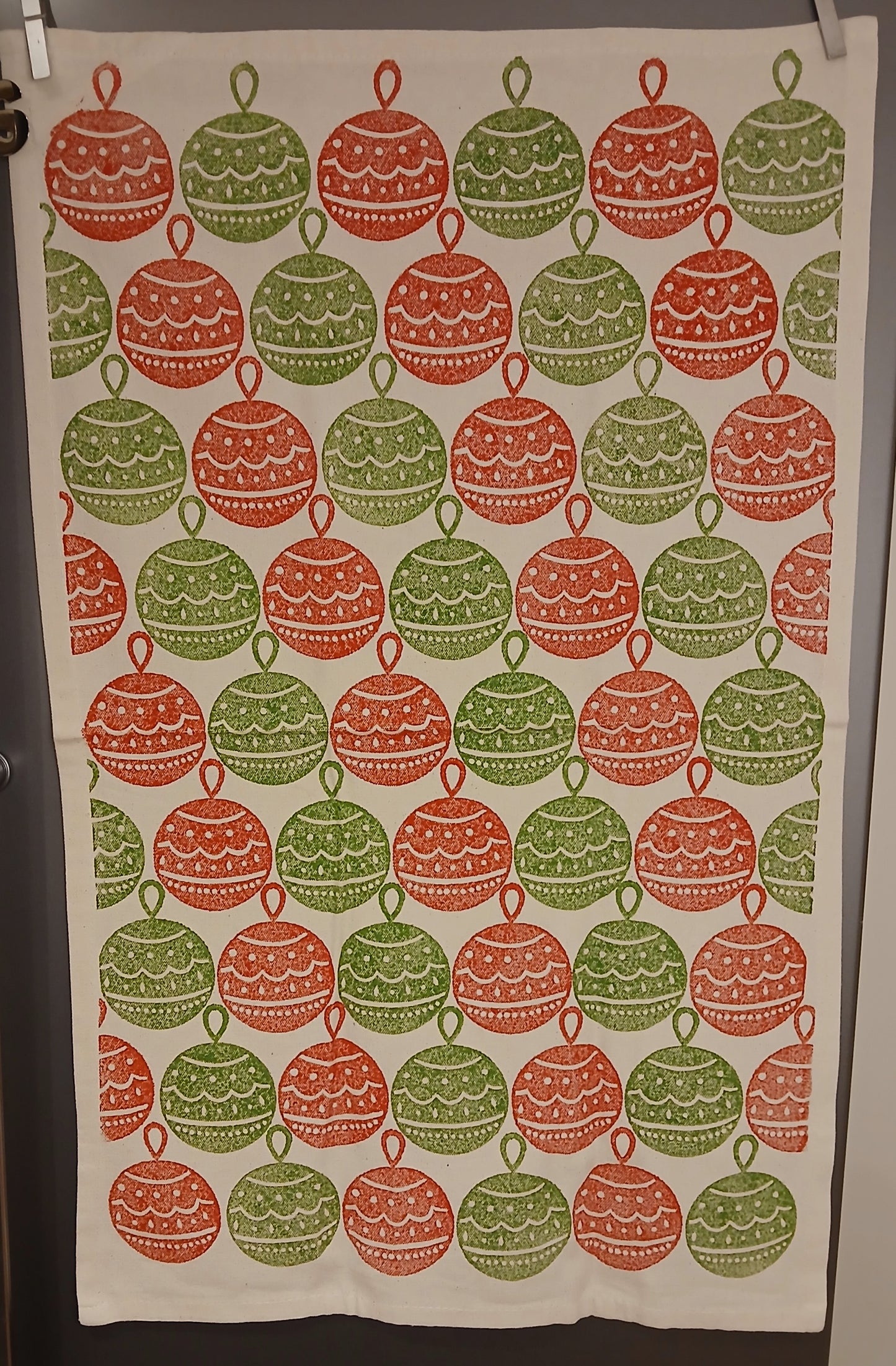 Christmas Baubles in red & green on cotton teatowel