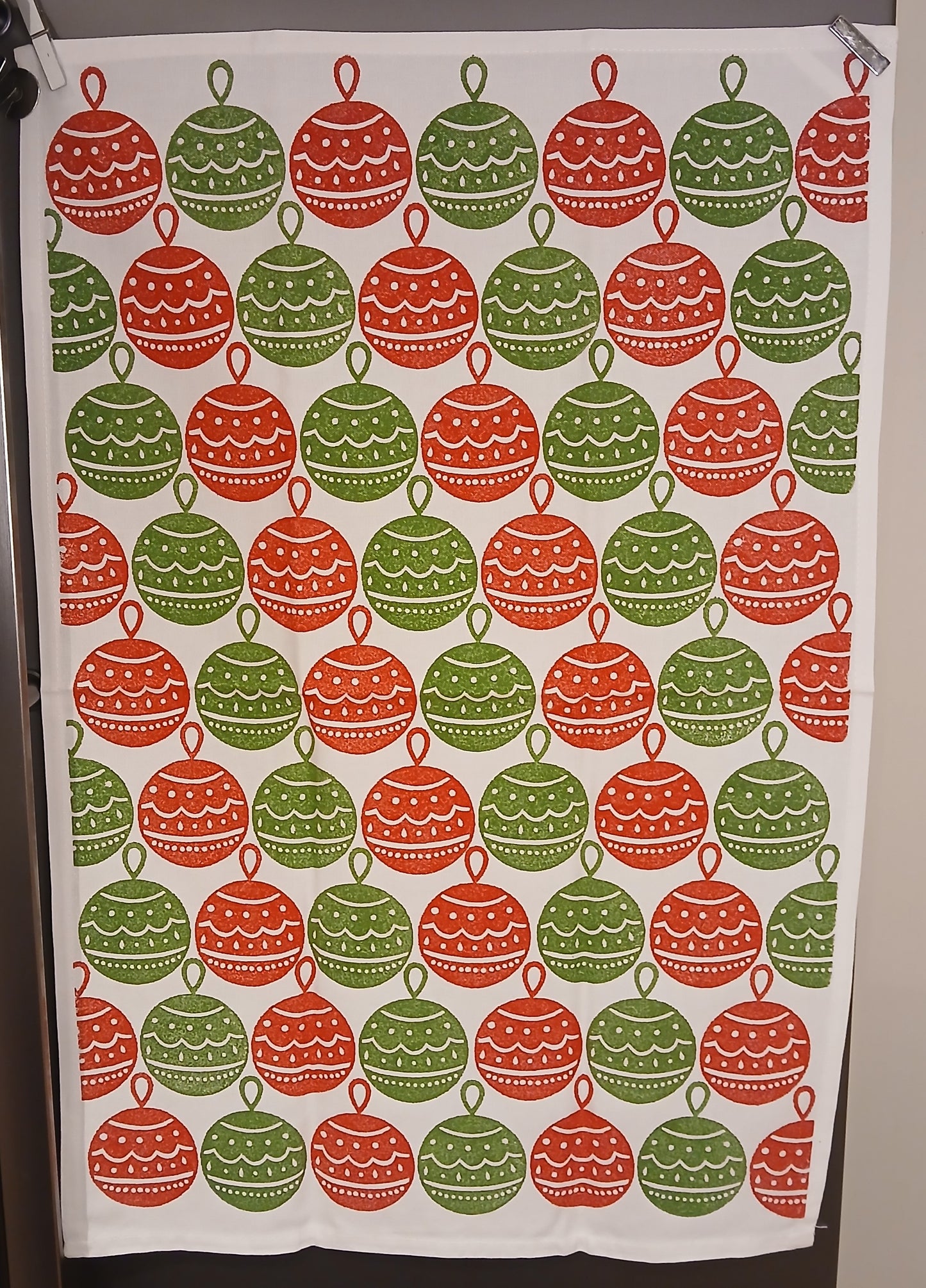 Christmas Baubles in red & green on cotton teatowel